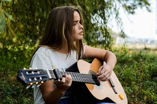 music woman playing gitar guitar