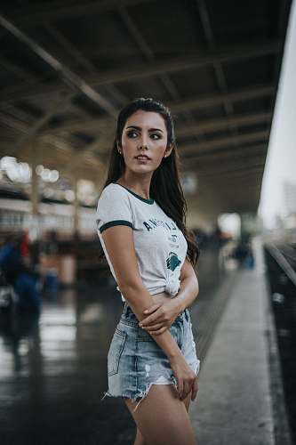 human woman standing in front of train person