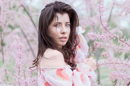 woman woman standing near pink leafed plant girl