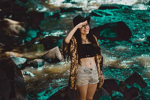 woman woman standing on rock near river girl