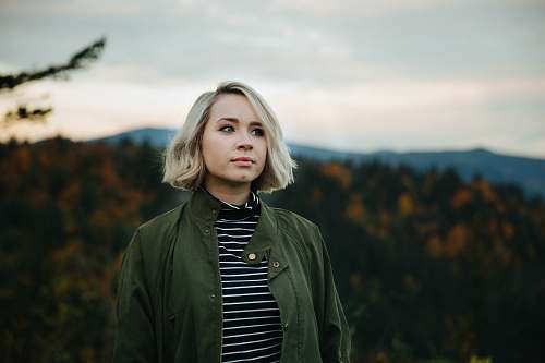 woman woman standing on top of mountain blonde