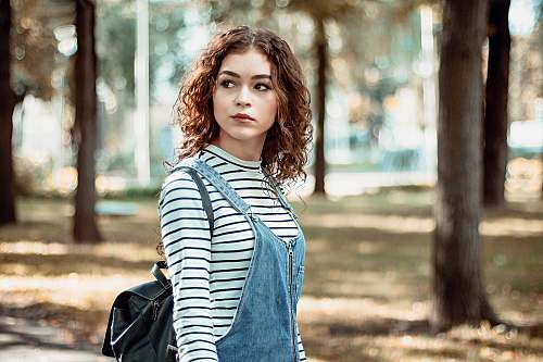 girl woman walking along the street woman