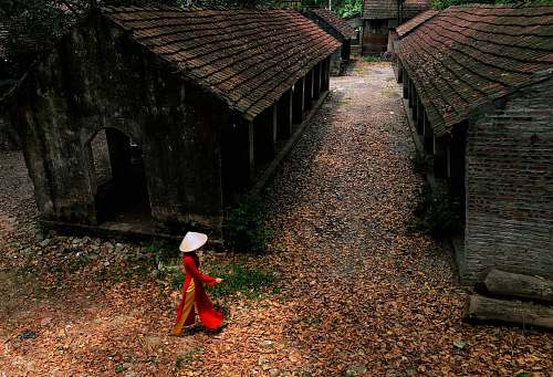 person woman walking near abandoned houses human