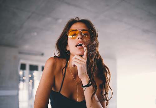 person woman wearing black tank top making post human
