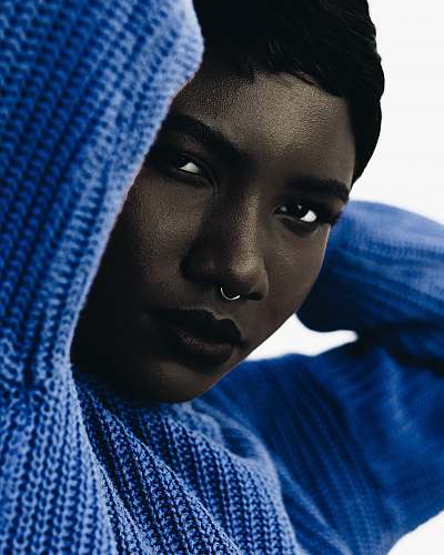 person woman wearing blue knit sweatshirt woman