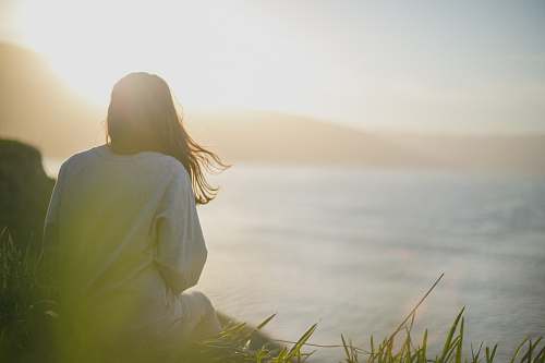 woman woman wearing gray long-sleeved shirt facing the sea female