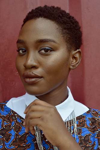 person women holding her collar standing near wall human