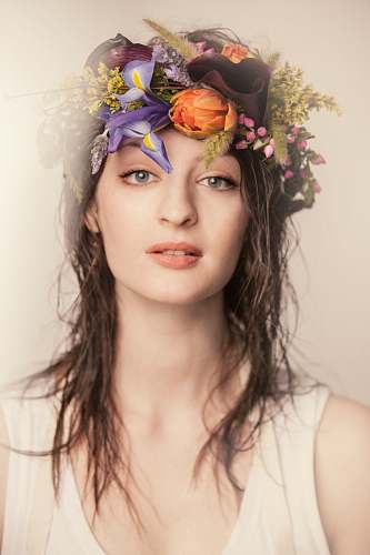 human women wearing floral headdress person