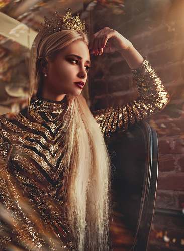 person women's gold long-sleeved dress human
