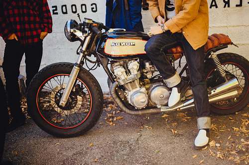 people black and gray Honda cafe racer bike
