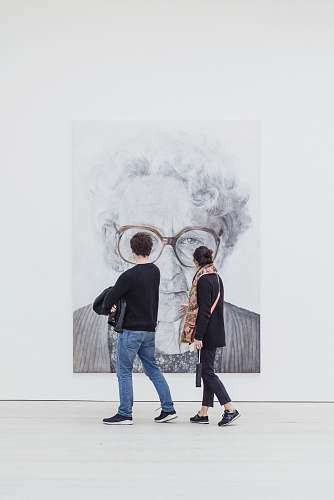 people man and woman looking at woman's painting human