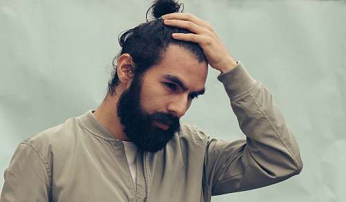 people man holding his black hair human