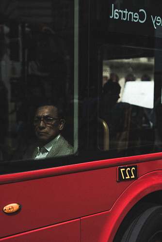people man sitting near vehicle window at daytime london