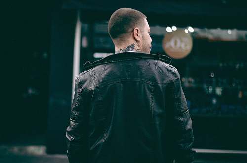 people man wearing black leather jacket human