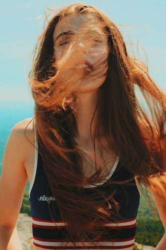 people photo of woman wiping her hair woman