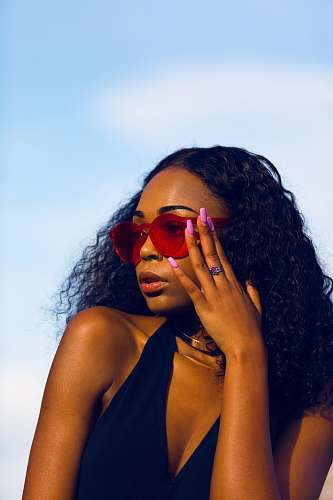 people woman holding her sunglasses human