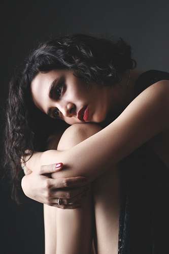 people woman leaning on her knees portrait