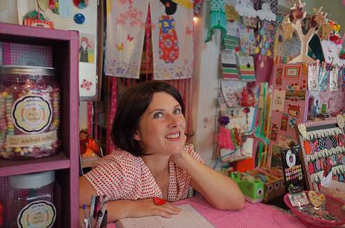 people woman leaning on pink desk human