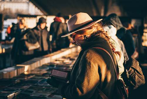 people woman reading book hat