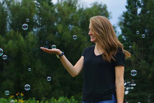 people woman standing in front of bubbles bubble