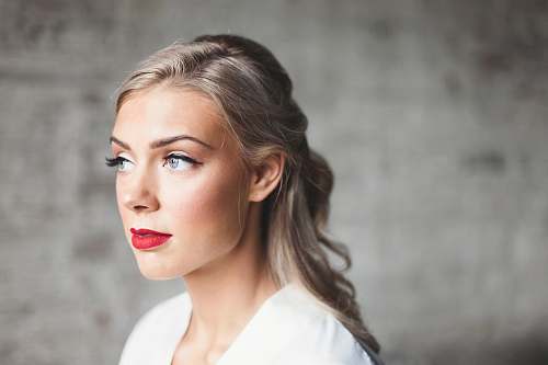people woman wearing white shirt with red lipstick woman