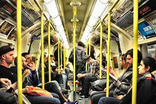train photo of group on people sitting inside train subway