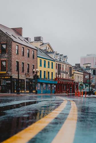  road beside buildings during daytime 