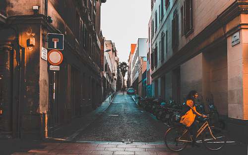 bike man riding bike near building transportation
