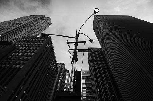building grayscale photo of concrete buildings architecture