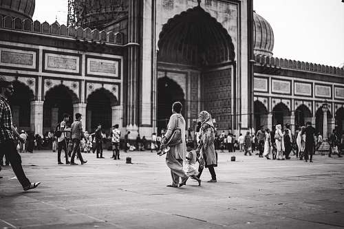 building grayscale photography of people city