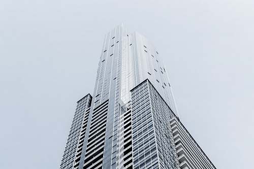 urban A tall skyscraper in Toronto against a pale blue sky architecture