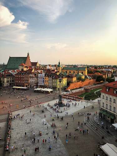 city aerial photograph of people walking on town square downtown
