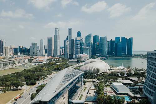 city aerial photography of curtain wall building metropolis