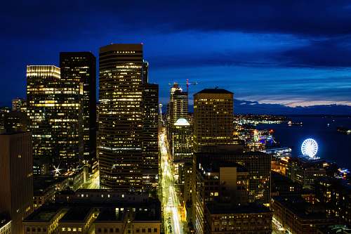 city aerial photography of lighted buildings during night time town