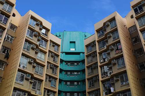 city architectural photography of brown and blue building high rise