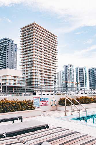 condo architectural photography of white and beige building housing