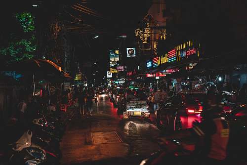 city assorted-color vehicles and neon light signages metropolis