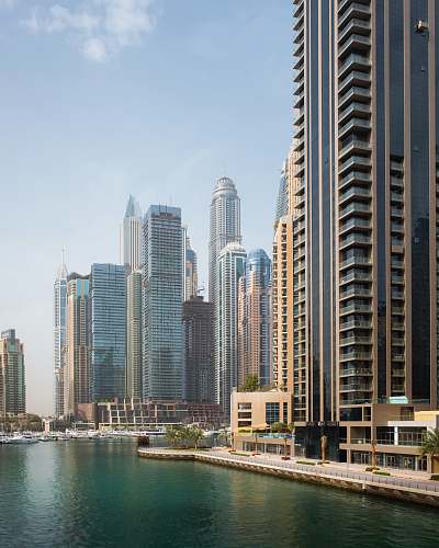 city body of water beside high-rise buildings urban