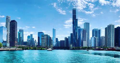 city body of water near buildings at daytime high rise