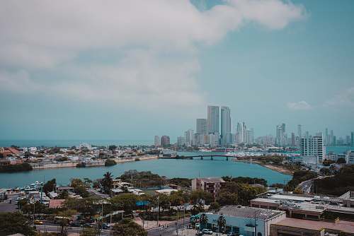 city body of water near buildings metropolis