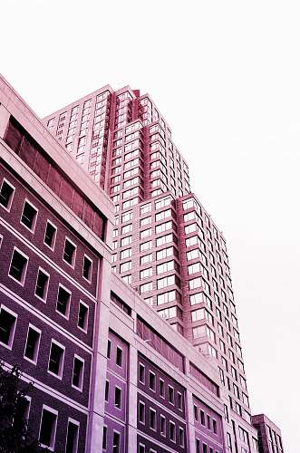 city brown and beige building under white sky high rise