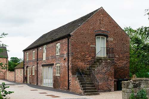 city brown and black clay building during daytime brick