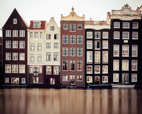 condo brown, black, and white houses housing