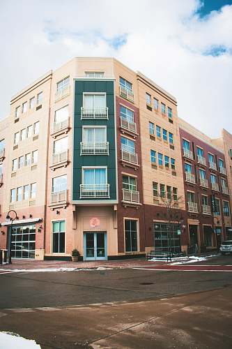 city brown building near road high rise