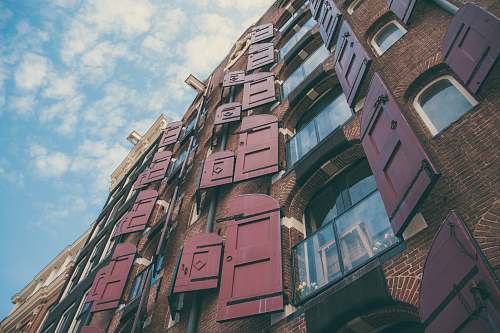 city brown high rise brick building high rise