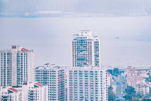city buildings near shore high rise