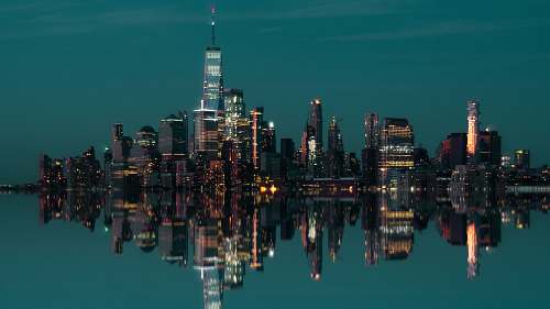 city city buildings near body of water urban