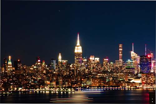 city cityscape during nighttime metropolis