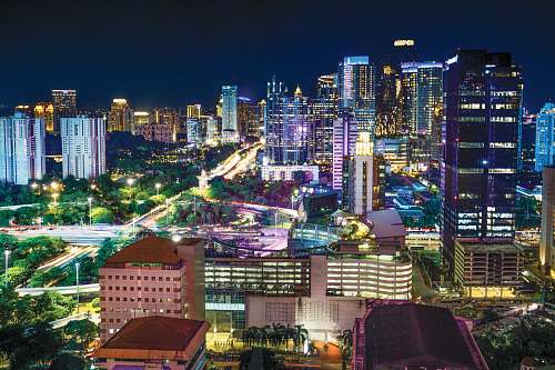 city cityscape with lights turned-on during nighttime urban