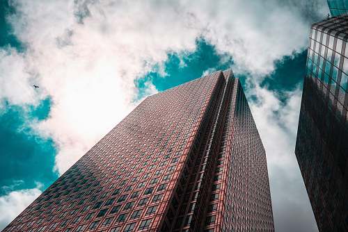 city curtain building under white clouds office building